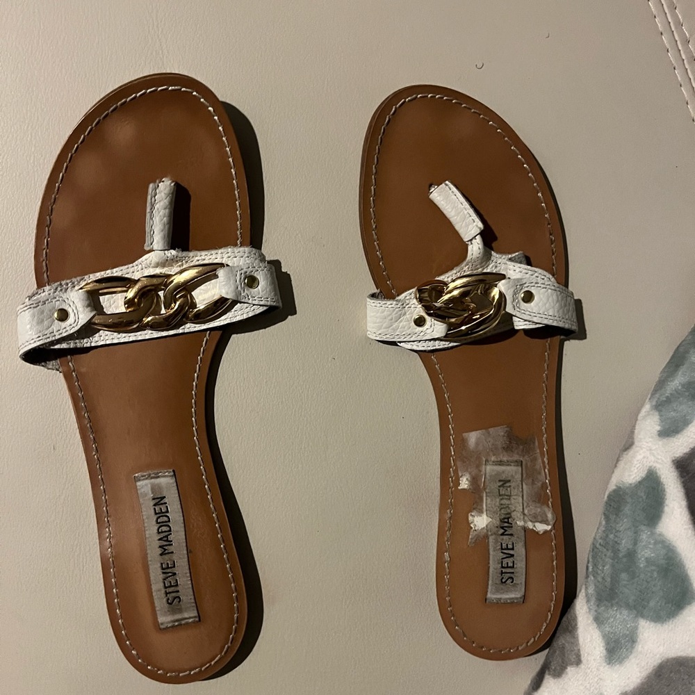 Flat, Steve Madden’s gold chain accent over leather thong sandals